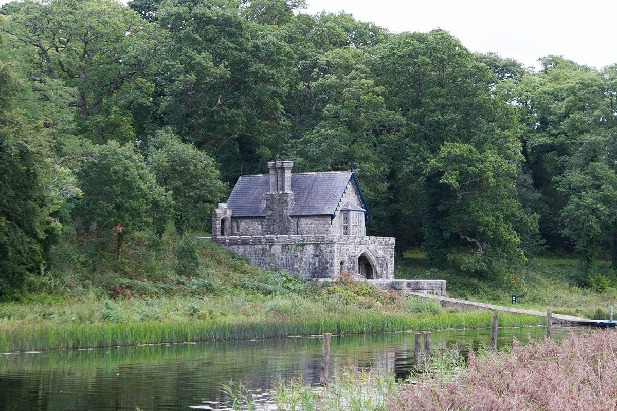 The Gothic boathouse on the wooded shore of Upper Lough Erne at Crom